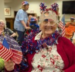 Carmelite resident waves flags and shows off her red, white, and blue for America.